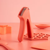 Fusion Twist Garlic Press - Coral