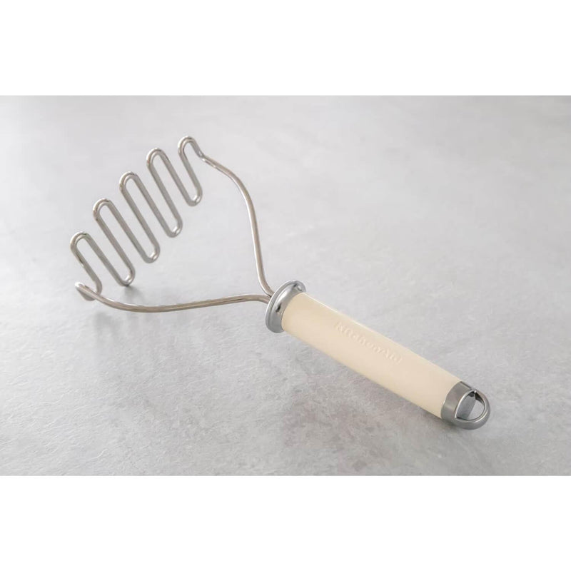KitchenAid Stainless Steel Masher - Almond Cream - Potters Cookshop