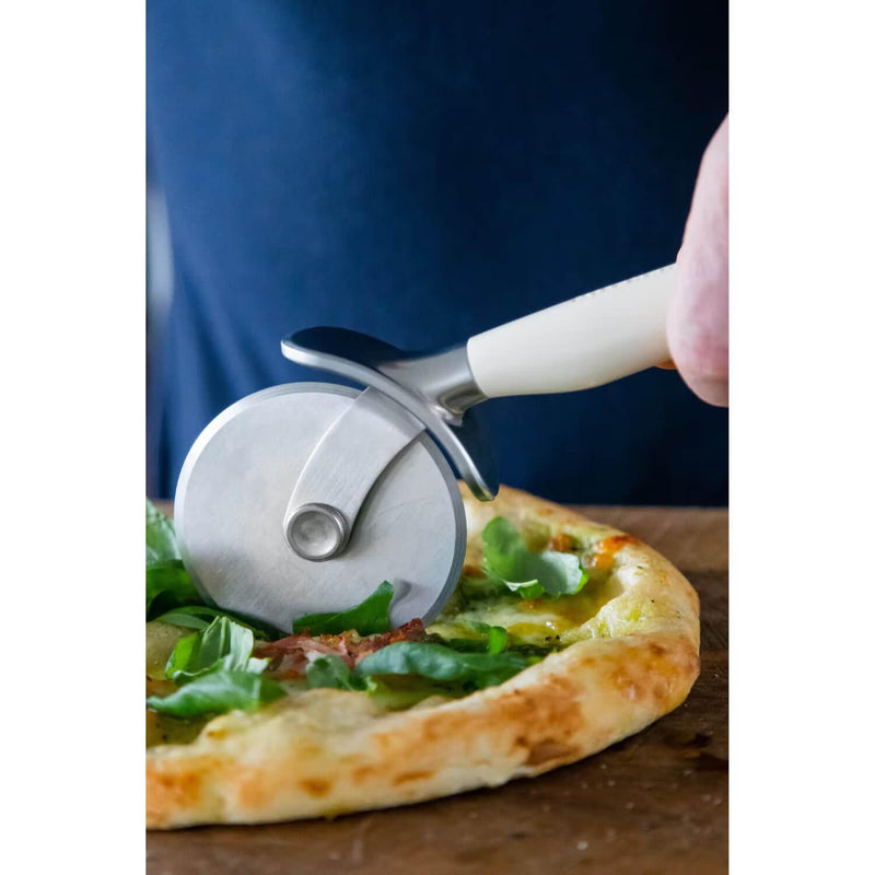 https://www.potterscookshop.co.uk/cdn/shop/products/KAG113OHACE-KitchenAid-Stainless-Steel-Pizza-Wheel-Almond-Cream-Lifestyle_800x.jpg?v=1657126441